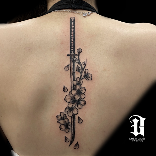 Explore ideas for spine tattoos, creative tattoo ideas in Addison, available at Cat Tattoo