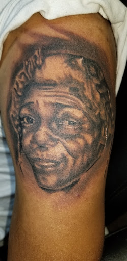 Explore lady ankle tattoo ideas, creative tattoo ideas in Angola, available at Hoodlum Ink