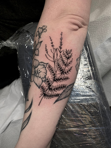 Find angel tattoo ideas for men for your next unique tattoo in Arlington at Benchmark Tattoos