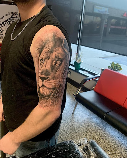 Explore american traditional elbow tattoo ideas, creative tattoo ideas in Fenton, available at Think Ink Tattoo Co