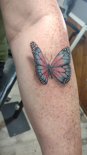 Explore hood neck tattoos ideas, creative tattoo ideas in Des Moines, available at Skin Kitchen Tattoo