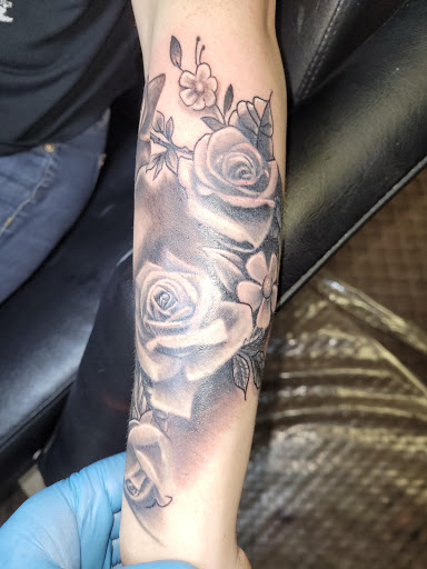 Explore elvis tattoo ideas, creative tattoo ideas in Angola, available at Hoodlum Ink