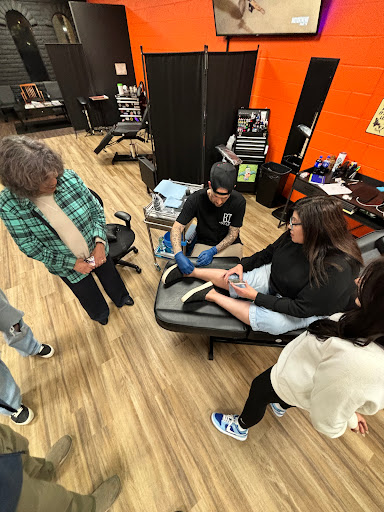 Explore dolphin tattoo ideas for females, creative tattoo ideas in Mesa, available at Ranger Tattoo & Piercing