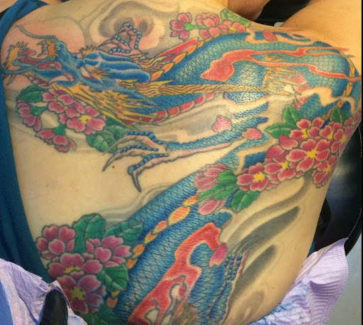 Find tattoo ideas between breast for your next unique tattoo in Miami at Tattoos by Lou Miami - North Miami