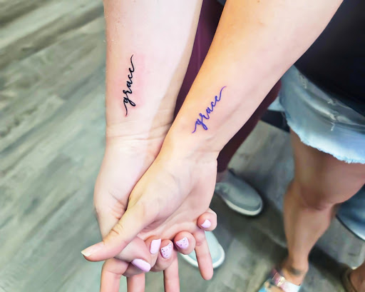 Explore small snake tattoo ideas, creative tattoo ideas in Casper, available at Luna & Lotus Amethyst Ink Angie Kay