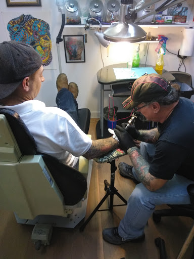 Explore leg tattoo male ideas, creative tattoo ideas in Anniston, available at Artistic Addictions