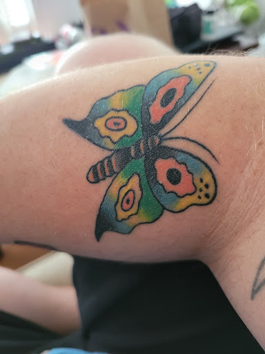 Explore neck tattoos for women ideas, creative tattoo ideas in Dallas, available at Cedar Springs Tattoo & Piercing