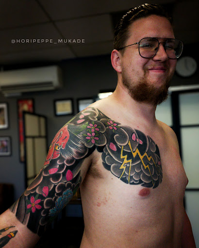 Explore behind the ear tattoo ideas for guys, creative tattoo ideas in Sacramento, available at Zero One Ink