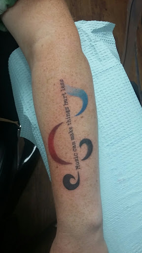 Explore sewing tattoo ideas, creative tattoo ideas in Stephenville, available at Electric Ink Tattoo Studio