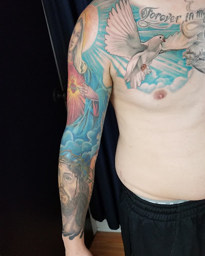 Explore superman tattoo ideas, creative tattoo ideas in Langhorne, available at Artists of Blue Velvet Tattoo