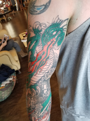 Explore tattoo ideas with flowers and names, creative tattoo ideas in Findlay, available at Gypsy Tattoo