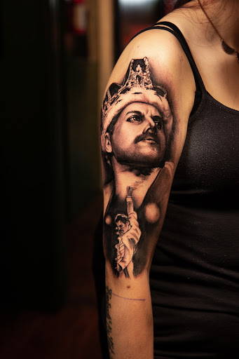 Find angel tattoo ideas for men for your next unique tattoo in Seaside at Sacred 8 Studios