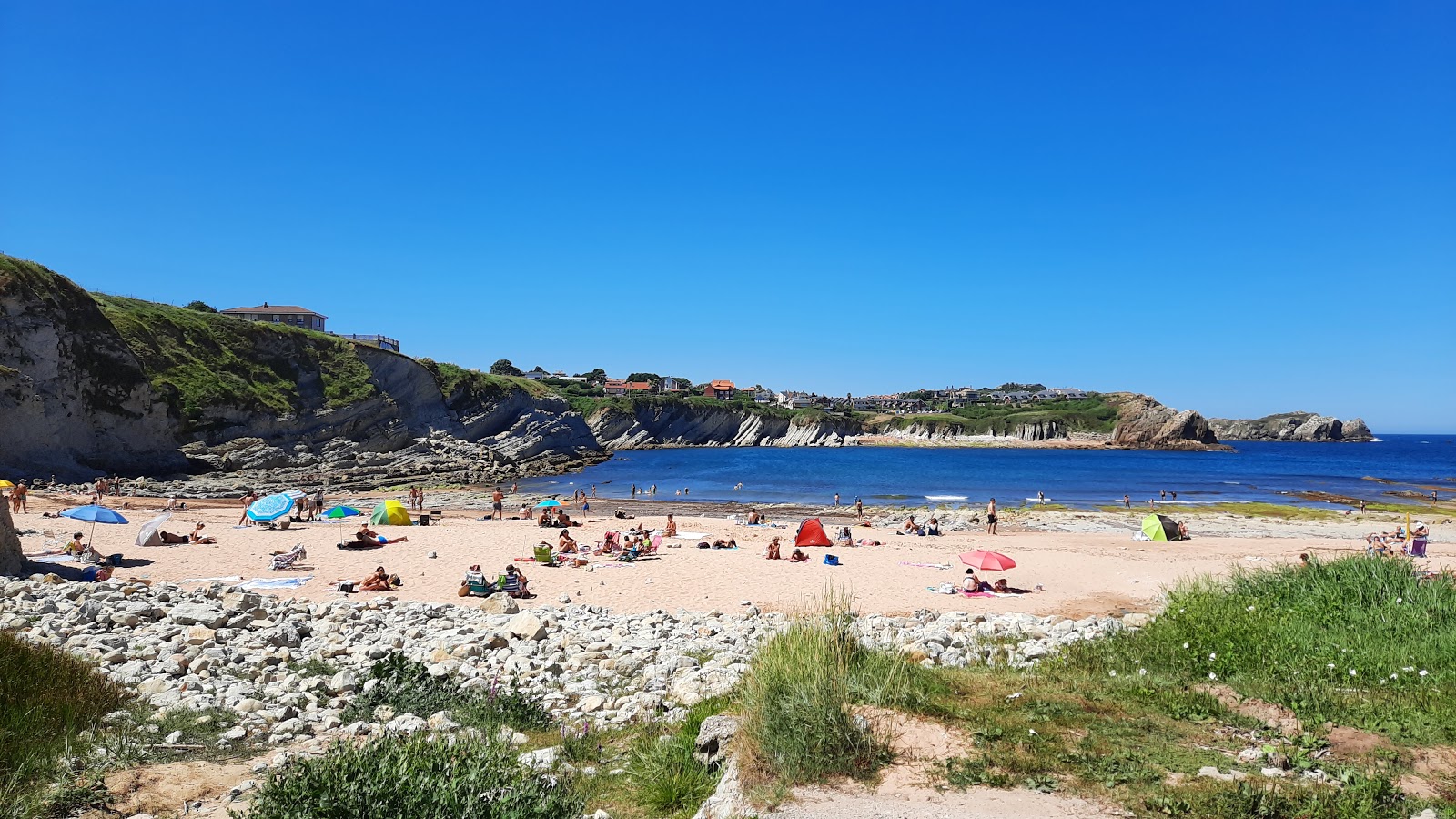 Photo of Playa de Portio with bright fine sand surface