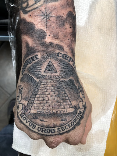 Explore dishonored tattoo ideas, creative tattoo ideas in Omaha, available at Revolution Studios tattoo