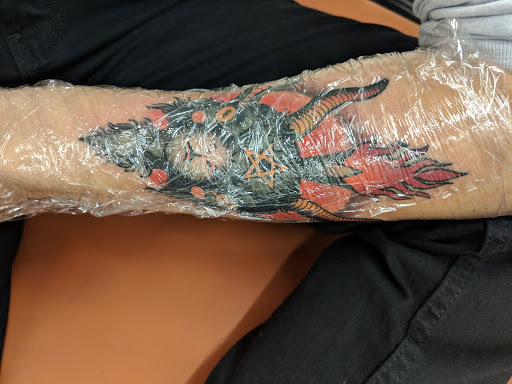 Explore dog collar tattoo ideas, creative tattoo ideas in Studio City, available at The Dolorosa Tattoo Studio