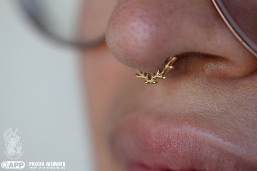 Explore female stomach tattoo ideas, creative tattoo ideas in Pompano Beach, available at Athena Body Adornment