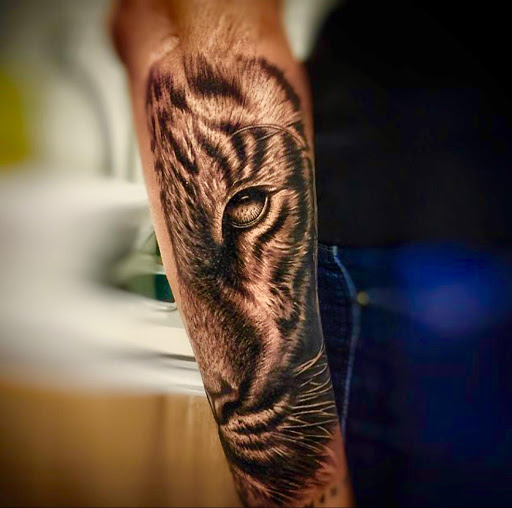 Explore small rose tattoo ideas, creative tattoo ideas in Miami Beach, available at Salvation Tattoo Lounge