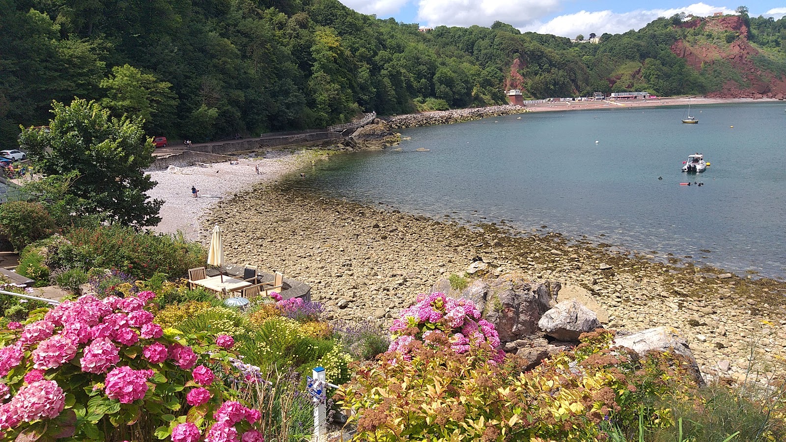Photo of Babbacombe beach with rocks cover surface