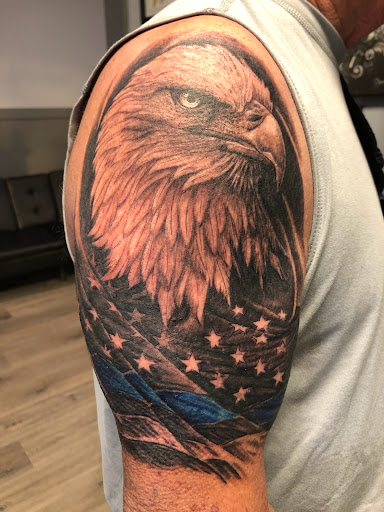 Explore lower back tattoo cover up ideas, creative tattoo ideas in Englewood, available at Point of Entry Tattoo