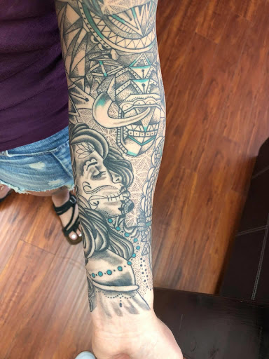 Explore family portrait tattoo ideas, creative tattoo ideas in Lewiston, available at Artistic Soul Tattoos