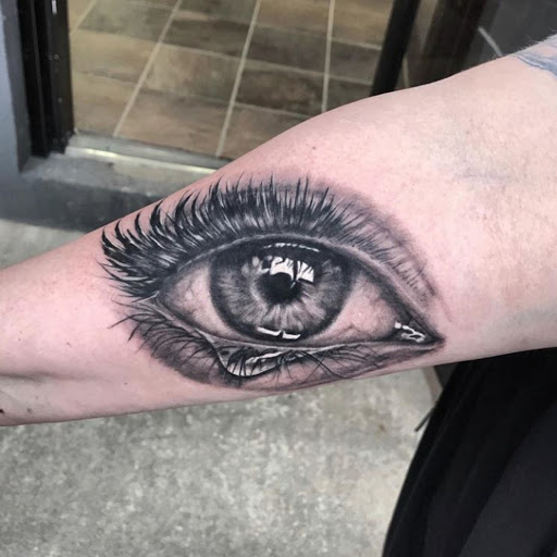 Explore bear sleeve tattoo ideas, creative tattoo ideas in Maryville, available at Passionfish Tattoo Studio