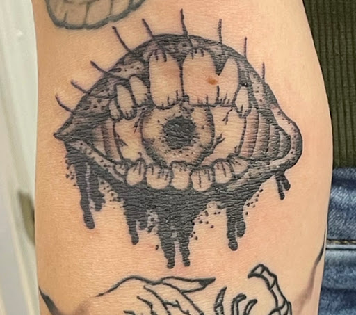 Explore lower back cover up tattoo ideas, creative tattoo ideas in Clarksville, available at Vanilla Gorilla Tattoo