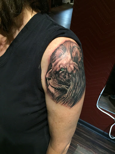 Explore reading tattoo ideas, creative tattoo ideas in Huntsville, available at Blacktide Tattoo Co.