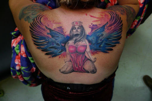 Explore dental tattoo ideas, creative tattoo ideas in Warrior, available at The Great Wilderness Tattoo