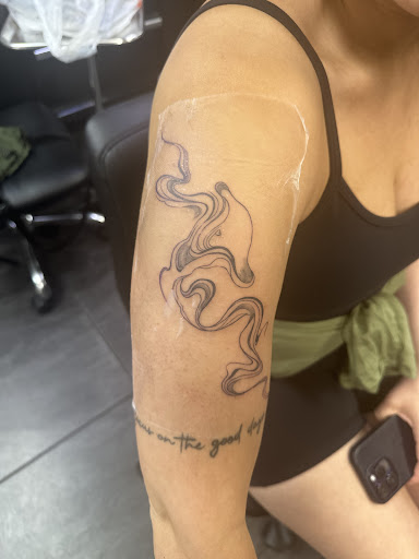 Explore cute dinosaur tattoo ideas, creative tattoo ideas in Deerfield Beach, available at Black Rose Tattoo Studio