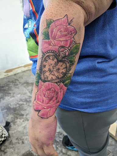 Explore red ink tattoo ideas for guys, creative tattoo ideas in Storm Lake, available at Alley Cat Tattoo