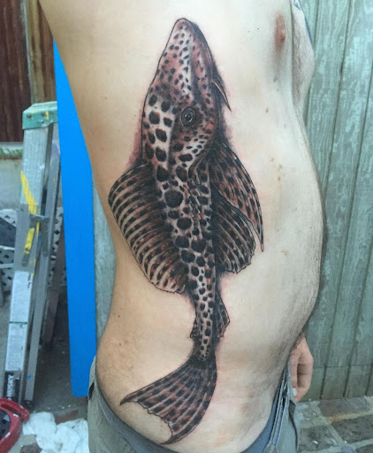 Explore neck tattoo ideas for men, creative tattoo ideas in Harrisburg, available at Rayzor Tattoos