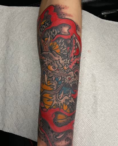 Explore lion sleeve tattoo ideas, creative tattoo ideas in Edgewood, available at Wild Coyote Tattoo