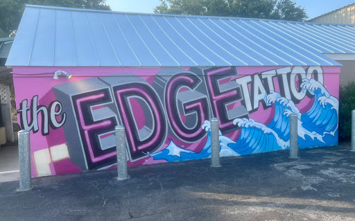 Explore red ink tattoo ideas for guys, creative tattoo ideas in Charleston, available at The Edge Tattoo Studio