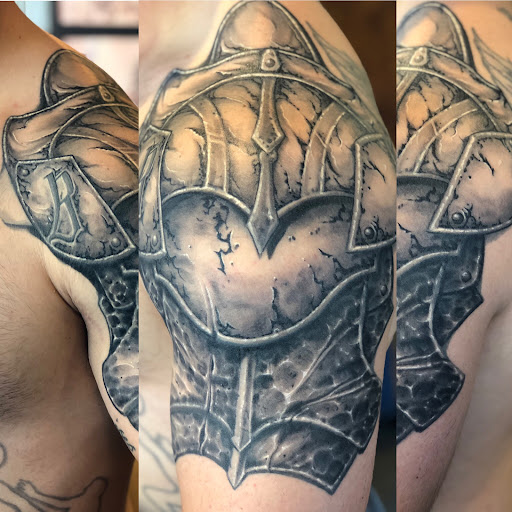 Explore chest plate tattoo ideas, creative tattoo ideas in Greer, available at Inkslingers Electric Tattooing