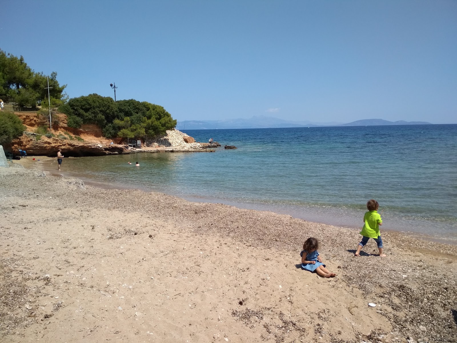 Foto von Argira Akti Beach mit beiger sand & kies Oberfläche