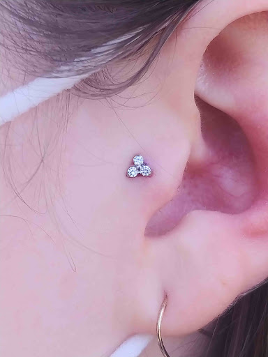 Explore neck tattoo ideas for females, creative tattoo ideas in Eau Claire, available at Steel N Ink Body Piercing