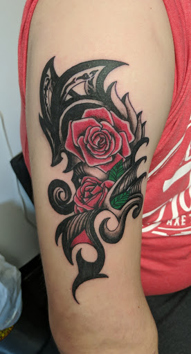 Find christmas tattoo ideas for your next unique tattoo in Summerville at Mystic Tiki Tattoo Studio & Gallery