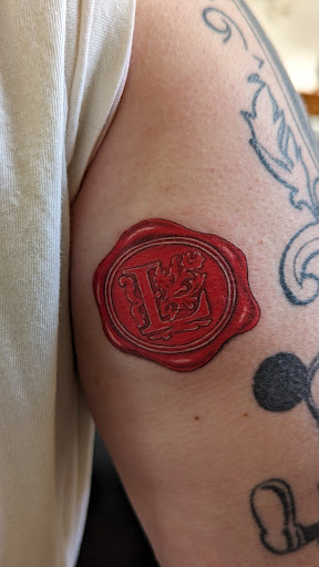 Explore arm flower tattoo ideas, creative tattoo ideas in Georgetown, available at Grasshopper Tattoo Studio