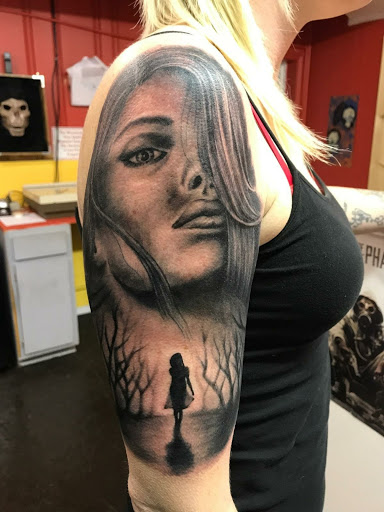 Explore mens western tattoo ideas, creative tattoo ideas in Phenix City, available at Skin Traditions Tattoo Studio