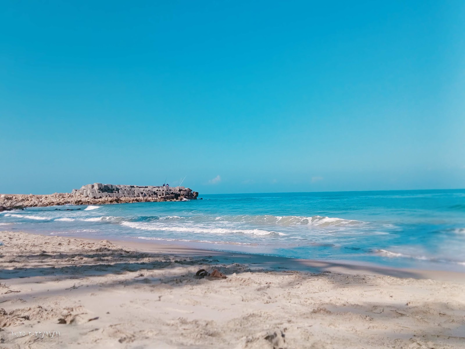 Foto de Al-Arish Beach com areia brilhante superfície