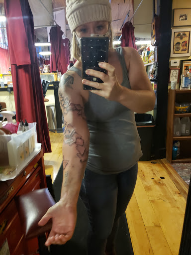 Explore squid tattoo ideas, creative tattoo ideas in Milwaukee, available at Mike Davenport Tattoo