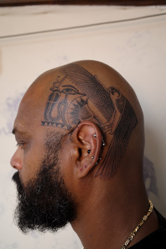 Explore tattoo ideas for women's lower back, creative tattoo ideas in Cambridge, available at Hour Glass Tattoo Studios