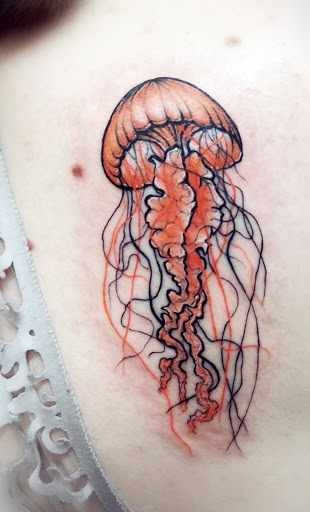 Explore female hand tattoo ideas, creative tattoo ideas in Benton, available at Spectrum Tattoo