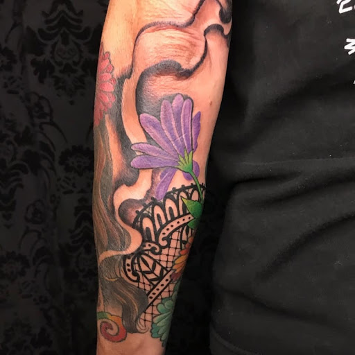 Find tattoo ideas for in between breast for your next unique tattoo in Maumelle at Lucky Bella Tattoos