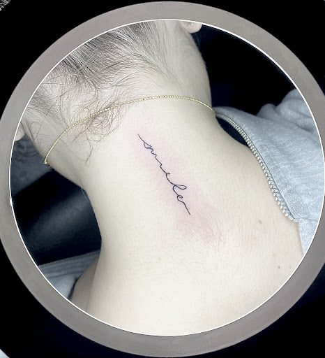 Explore neck tattoo ideas for women, creative tattoo ideas in Wilmington, available at Rogue Tattoo Studio