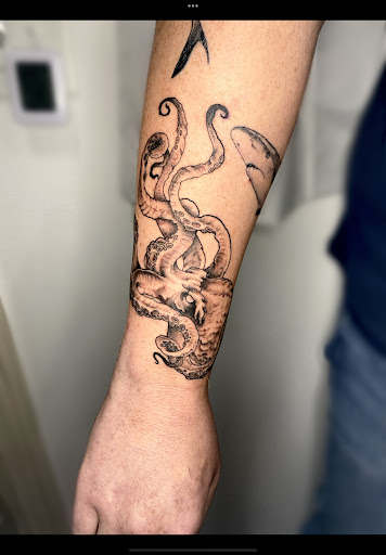 Explore cat outline tattoo ideas, creative tattoo ideas in Wilmington, available at Rogue Tattoo Studio