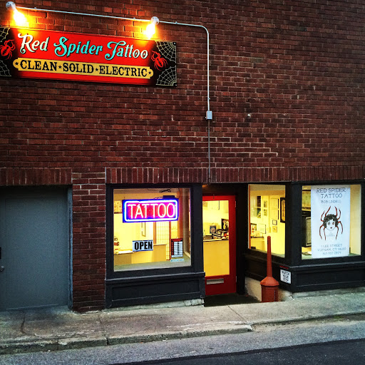 Explore lady thigh tattoo ideas, creative tattoo ideas in Putnam, available at Red Spider Tattoo