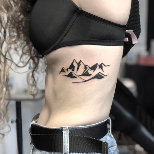 Explore mask tattoo ideas, creative tattoo ideas in Loveland, available at R&G Body Art