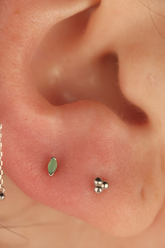 Explore nail technician tattoo ideas, creative tattoo ideas in Buffalo, available at Moria Piercing and Jewelry