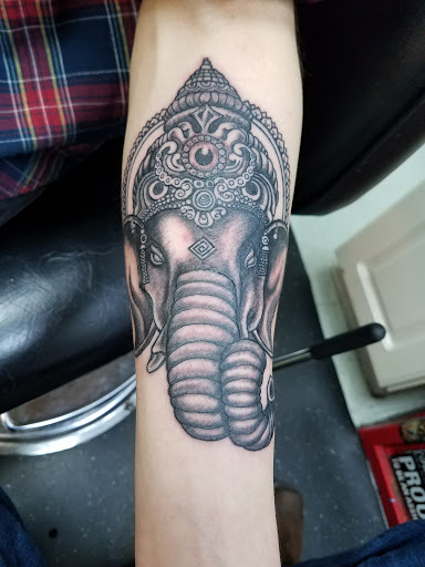 Explore campfire tattoo ideas, creative tattoo ideas in Libertyville, available at Art With Atattooed